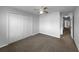 Bedroom with carpet, closet, and a view to the hallway at 5413 River Rock Rd, Lakeland, FL 33809