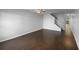 Expansive living room with hardwood floors, a ceiling fan, and abundant natural light flowing into the space at 5413 River Rock Rd, Lakeland, FL 33809