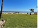 Serene lawn with palm trees and beautiful ocean view at 573 N Atlantic Ave # 5, New Smyrna Beach, FL 32169
