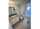 Bathroom featuring a vanity, mirror, and toilet at 573 N Atlantic Ave # 5, New Smyrna Beach, FL 32169