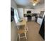 Well-equipped kitchen with stainless steel appliances, granite countertops, and a convenient dining area at 573 N Atlantic Ave # 5, New Smyrna Beach, FL 32169