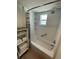 Bright shower and tub combination with white subway tile at 573 N Atlantic Ave # 5, New Smyrna Beach, FL 32169
