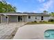 Backyard featuring a patio, concrete pavers, and a refreshing pool, perfect for outdoor living at 6740 Se 107Th St, Belleview, FL 34420