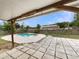 Inviting backyard featuring a charming patio, refreshing pool, and ample green space at 6740 Se 107Th St, Belleview, FL 34420