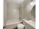 Clean bathroom with shower over tub, subway tiles, and modern vanity at 6740 Se 107Th St, Belleview, FL 34420