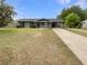 Well-maintained home with a covered portico and a neatly landscaped front yard at 6740 Se 107Th St, Belleview, FL 34420