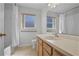 Bathroom featuring a window for natural light, vanity, and shower-tub combo at 7606 Fordham Creek Ln, Orlando, FL 32818