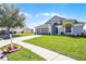 Charming single-story home with well-manicured lawn and a two car garage at 7606 Fordham Creek Ln, Orlando, FL 32818