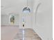 Bright foyer with arched doorway and a view of the living room at 7606 Fordham Creek Ln, Orlando, FL 32818