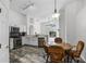 Bright kitchen features stainless appliances, white cabinets and breakfast nook at 7606 Fordham Creek Ln, Orlando, FL 32818