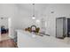 Bright kitchen featuring white countertops and cabinets and a black sink at 7606 Fordham Creek Ln, Orlando, FL 32818