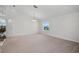 Spacious living room with a view of the front yard and vaulted ceilings at 7606 Fordham Creek Ln, Orlando, FL 32818