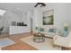 Bright living room features modern lighting, neutral tones, and an open layout at 7606 Fordham Creek Ln, Orlando, FL 32818