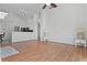 Spacious living room featuring vaulted ceiling, hardwood floors and an open floor plan to the kitchen at 7606 Fordham Creek Ln, Orlando, FL 32818