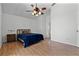 A spacious primary bedroom featuring light floors and a ceiling fan at 7606 Fordham Creek Ln, Orlando, FL 32818