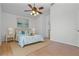 Relaxing main bedroom with light blue accents, a ceiling fan and a soothing ambiance at 7606 Fordham Creek Ln, Orlando, FL 32818