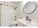 Full bathroom with subway tiles, black fixtures, a bathtub and shower combo and a white single sink vanity at 8003 Lake Nellie Rd, Clermont, FL 34714