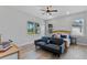 Bright bedroom with neutral walls, wood floors, a large window with a view, and a stylish platform bed at 8003 Lake Nellie Rd, Clermont, FL 34714
