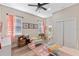 Charming bedroom with twin beds, playful decor, and a connecting bathroom at 8003 Lake Nellie Rd, Clermont, FL 34714