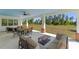 Covered patio with ceiling fan, offering a relaxing outdoor living space at 8003 Lake Nellie Rd, Clermont, FL 34714