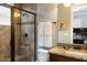 Bathroom featuring granite countertop, updated shower, and modern fixtures, enhanced by soft lighting and clean design at 834 Golden Bear Dr, Reunion, FL 34747