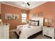Charming bedroom featuring a comfortable queen-size bed with decorative bedding, complemented by bedside tables and lamps at 834 Golden Bear Dr, Reunion, FL 34747