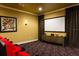Home theater boasting a large projection screen and cozy seating, ideal for movie nights and entertainment at 834 Golden Bear Dr, Reunion, FL 34747