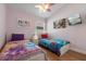 bedroom with two twin beds, ceiling fan, and princess decor at 838 Kildrummy Dr, Davenport, FL 33896