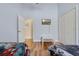 bedroom with wooden floors and two twin beds at 838 Kildrummy Dr, Davenport, FL 33896
