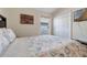 Bedroom with a decorative bedspread, a painting, and a window with horizontal blinds at 838 Kildrummy Dr, Davenport, FL 33896