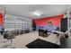 Finished garage featuring a ping pong table, foosball, black carpet, bar stools, and painted walls at 838 Kildrummy Dr, Davenport, FL 33896
