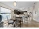 Bright kitchen featuring dark cabinets, stainless steel appliances, and a cozy breakfast nook at 838 Kildrummy Dr, Davenport, FL 33896