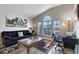 Comfortable living room with abundant natural light and an adjacent workstation at 838 Kildrummy Dr, Davenport, FL 33896