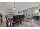Spacious open concept living room featuring large windows and a combination dining and living space at 838 Kildrummy Dr, Davenport, FL 33896