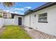 View of a well-lit, brick-paved back entrance with a storm door and window at 843 W Swoope Ave, Winter Park, FL 32789