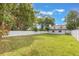 A spacious backyard featuring a white vinyl privacy fence and a lush lawn, perfect for outdoor activities at 843 W Swoope Ave, Winter Park, FL 32789