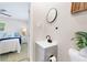Cozy bathroom featuring a sink vanity and a bedroom visible in background at 843 W Swoope Ave, Winter Park, FL 32789