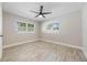 Bright bedroom with natural light, wood-look flooring and modern ceiling fan at 843 W Swoope Ave, Winter Park, FL 32789