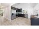 Modern kitchen features stainless steel appliances, dark cabinetry, and sleek, stylish finishes at 843 W Swoope Ave, Winter Park, FL 32789