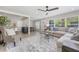 Bright living room flowing into dining area, featuring a comfortable sectional and stylish decor at 843 W Swoope Ave, Winter Park, FL 32789
