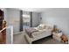 Cozy bedroom designed with a serene color scheme, a comfortable bed, and a view to the neighborhood at 8971 California Palm Rd, Kissimmee, FL 34747