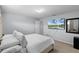 Well-lit bedroom with a TV, closet and private bathroom at 8971 California Palm Rd, Kissimmee, FL 34747