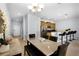 Dining room features granite counters, stainless appliances and open concept design to living spaces at 8971 California Palm Rd, Kissimmee, FL 34747