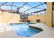Backyard pool with a lounge seating and a screened-in patio at 8971 California Palm Rd, Kissimmee, FL 34747