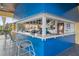 Outdoor bar with seating, perfect for enjoying a refreshing drink and snack by the pool at 8971 California Palm Rd, Kissimmee, FL 34747