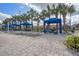 Poolside cabanas and lounge chairs offer a relaxing spot to soak up the sun at 8971 California Palm Rd, Kissimmee, FL 34747