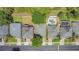 Aerial view of houses with a swimming pool, backyard, and luscious green trees at 9999 Shadow Creek Dr, Orlando, FL 32832