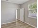 Bedroom featuring wood-look flooring and a view through the open door at 9999 Shadow Creek Dr, Orlando, FL 32832