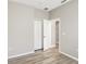 This bedroom has wood-look floors, and neutral paint at 9999 Shadow Creek Dr, Orlando, FL 32832