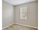 Bedroom featuring wood-look flooring and a window at 9999 Shadow Creek Dr, Orlando, FL 32832